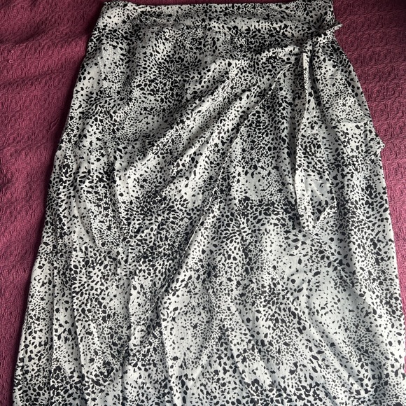Black and white animal print midi skirt with a satin ish feel to it. - Picture 1 of 5